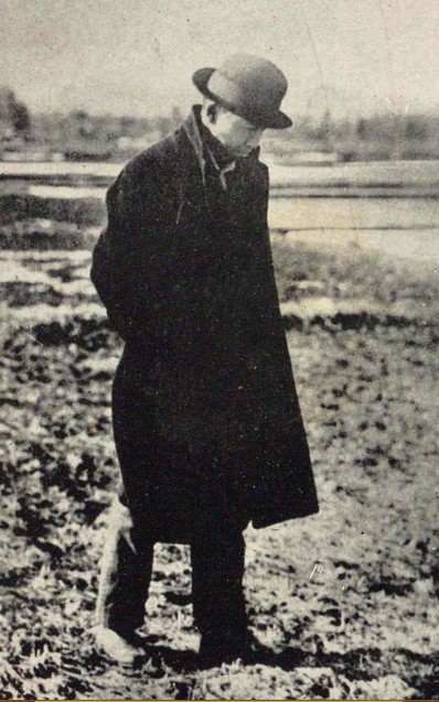 Miyazawa Kenji walking in a long coat